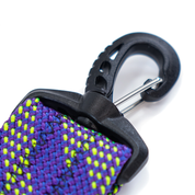 Close-up of a purple and green rope  strap with a black carabiner on a white background