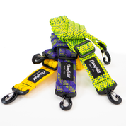 Yellow, purple, and green recycled rope bag straps on a white background