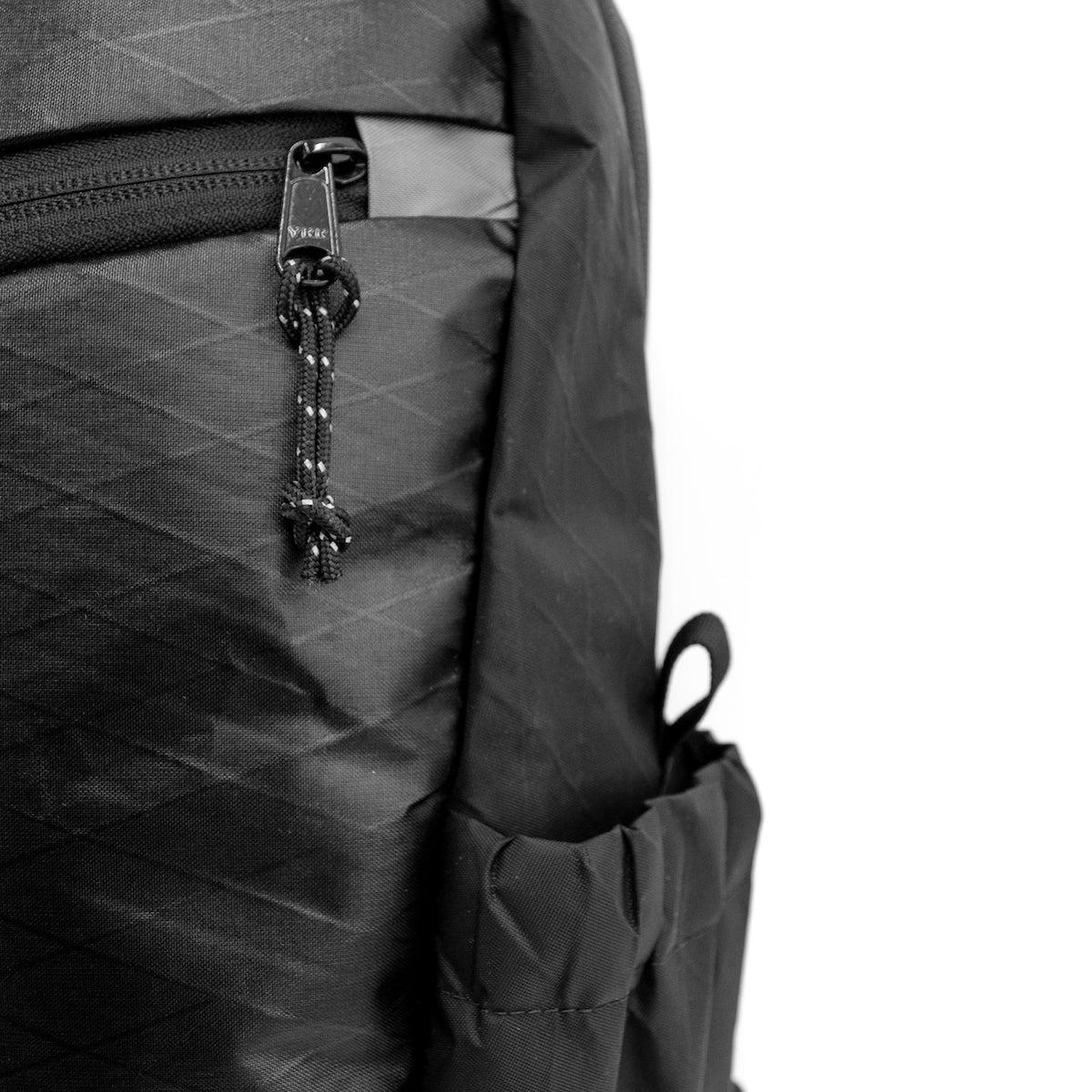Flowfold 18L Optimist large backpack with water bottle sleeves closeup waterproof xpac fabric