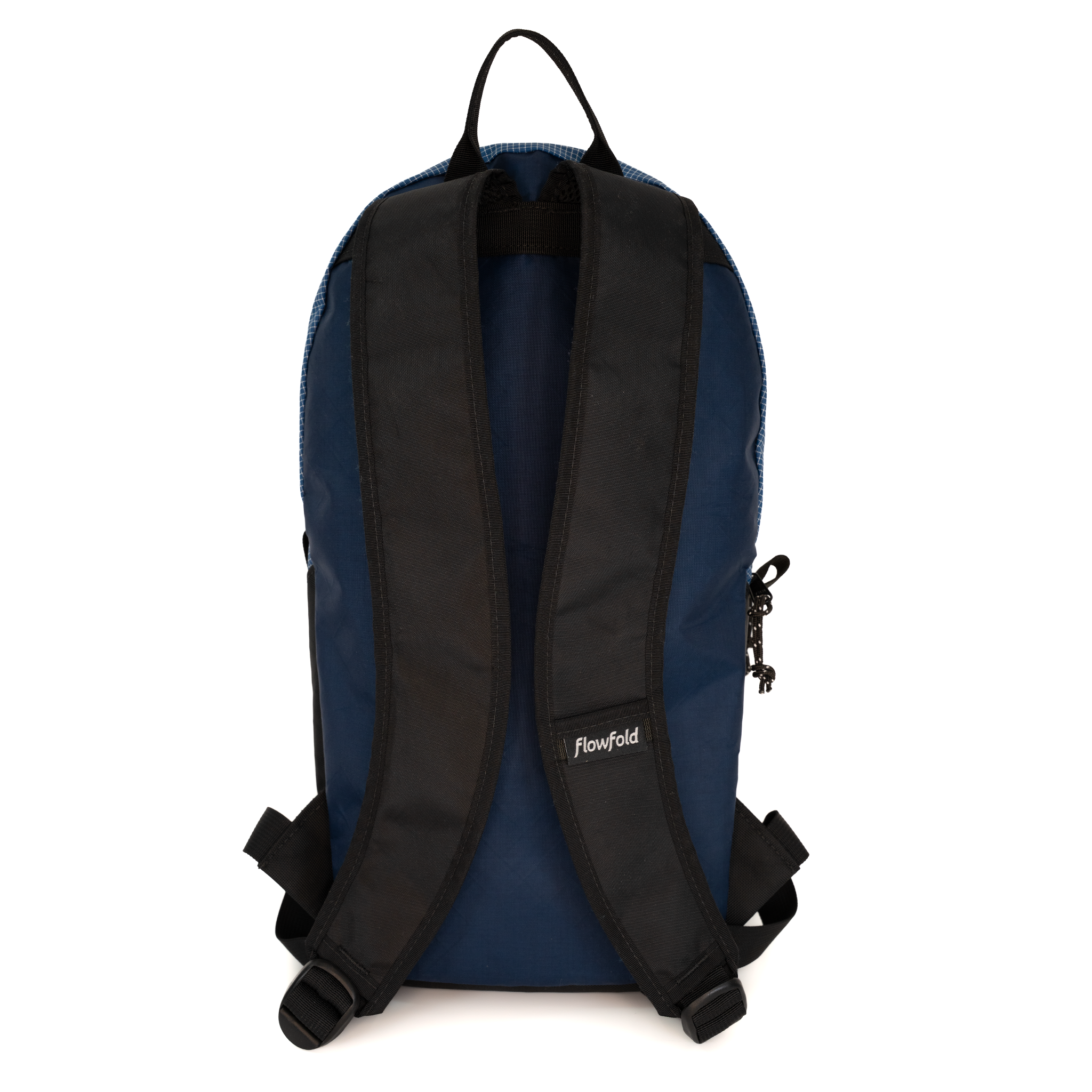 The back view of a Flowfold backpack in navy blue and black, showing the padded shoulder straps, zipper, and brand label on a white background.