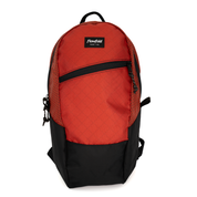 A red and black Flowfold backpack with a top handle and front zippered pocket, shown on a plain white background.