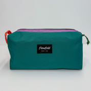 Teal and purple color block toiletry bag 