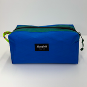 Blue and teal color block toiletry bag 