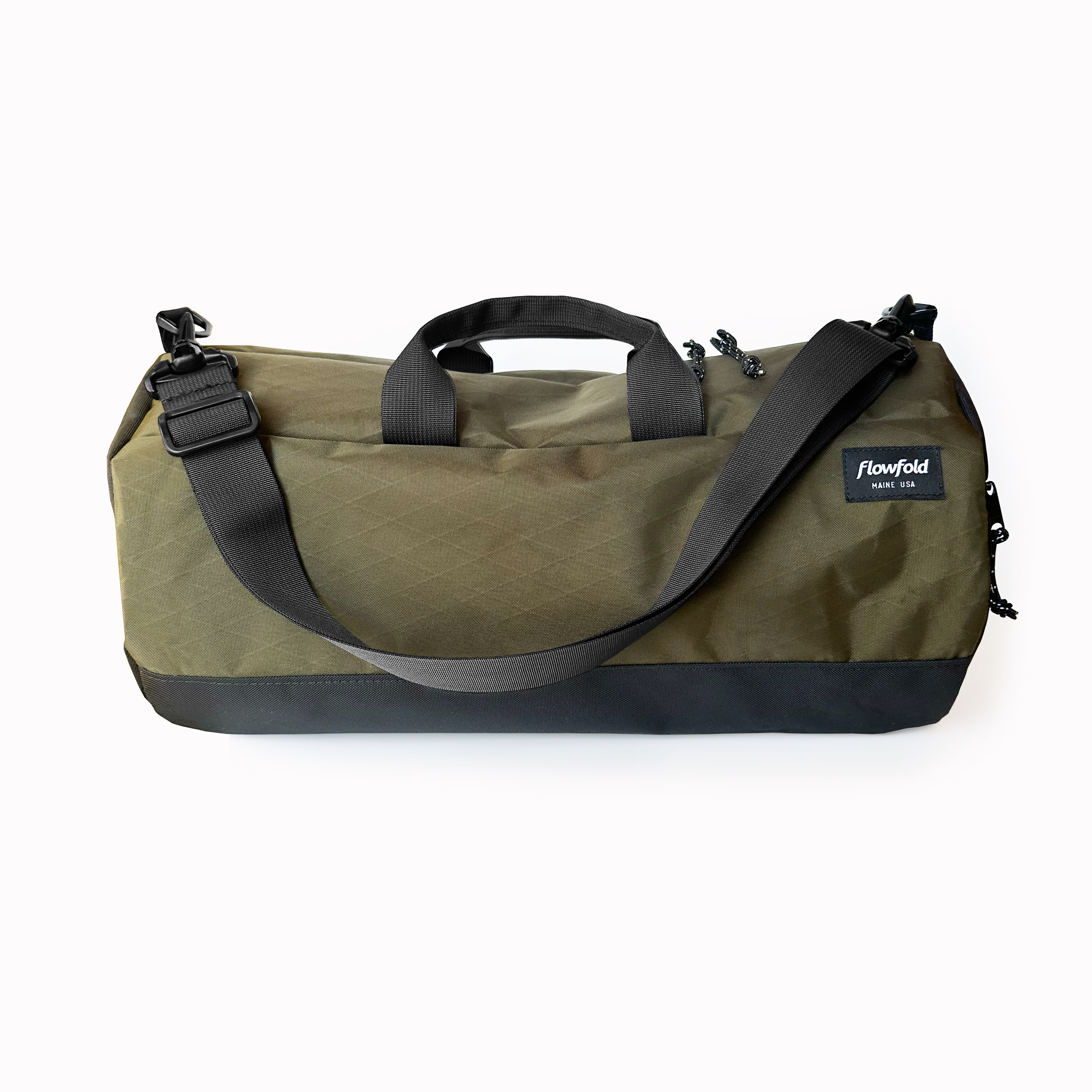 A green Conductor 20L duffle bag with black straps and a logo on the side, set against a plain background.
