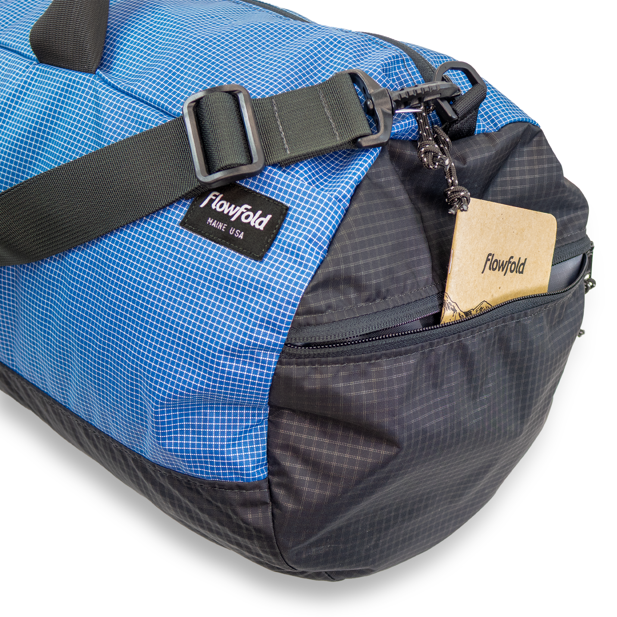 Blue and black duffle bag with Flowfold branding on a white background