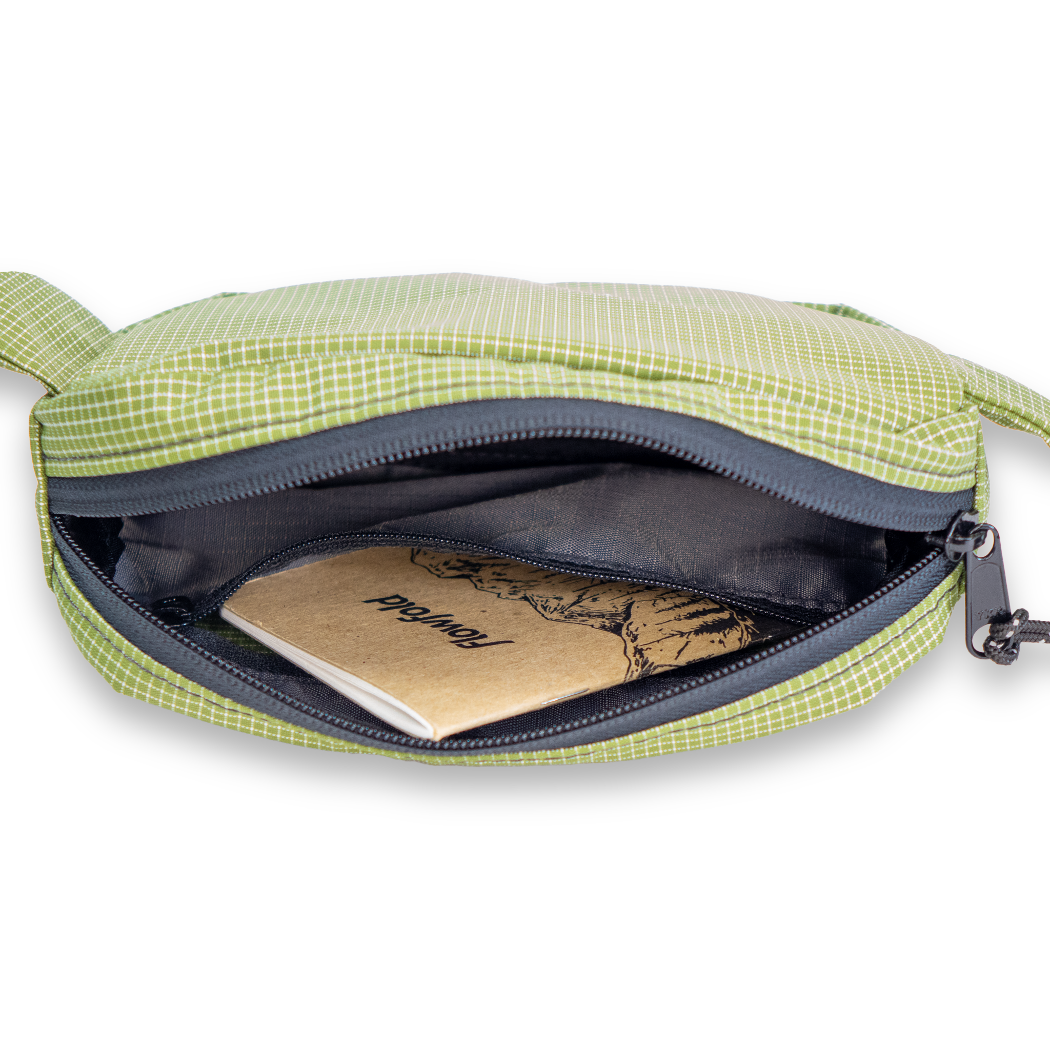 Olive green belt bag with a notebook inside showing an interior zipper pocket on a white background