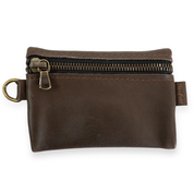Brown leather pouch with zipper on a white background