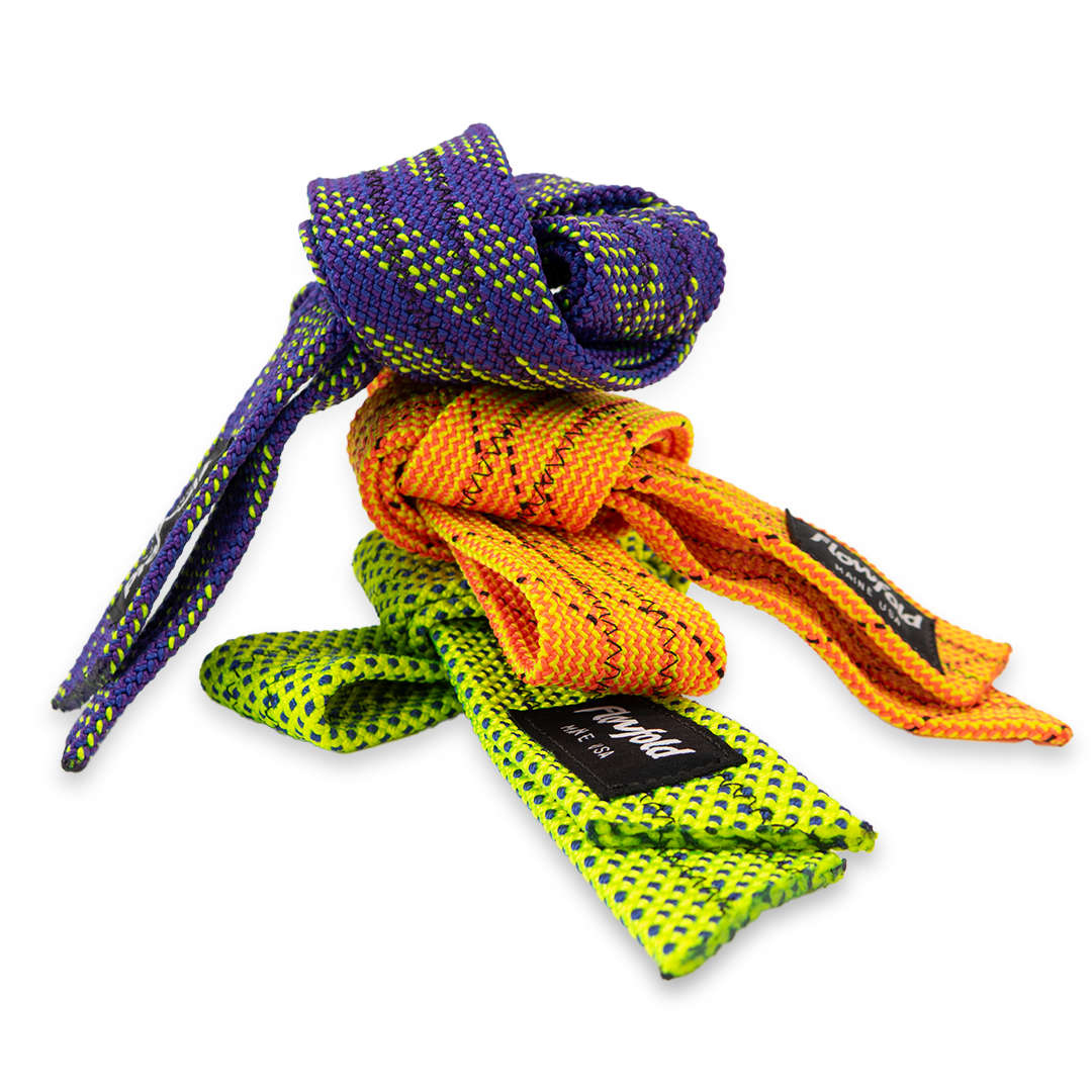 Hollow rope straps in lime, tangerine, and eggplant stacked on top of each other