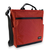 Red bag with black zipper and strap on a white background