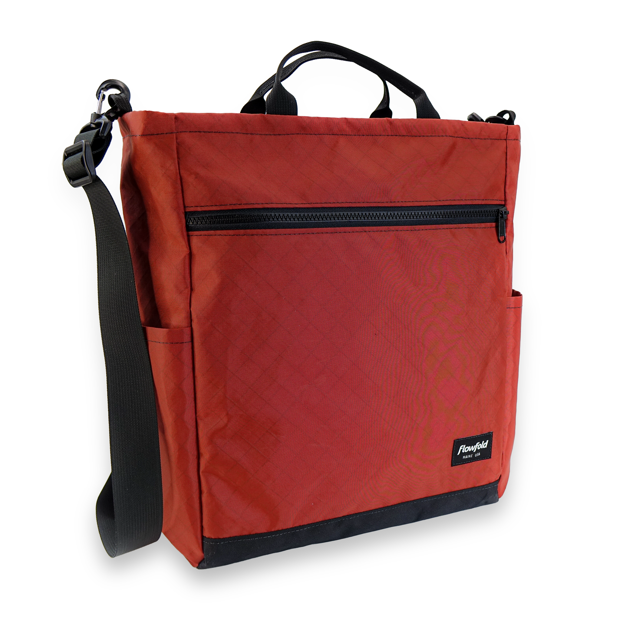 Red bag with black zipper and strap on a white background
