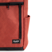 Crossbody bag showing the details, a key leash and a side pouch