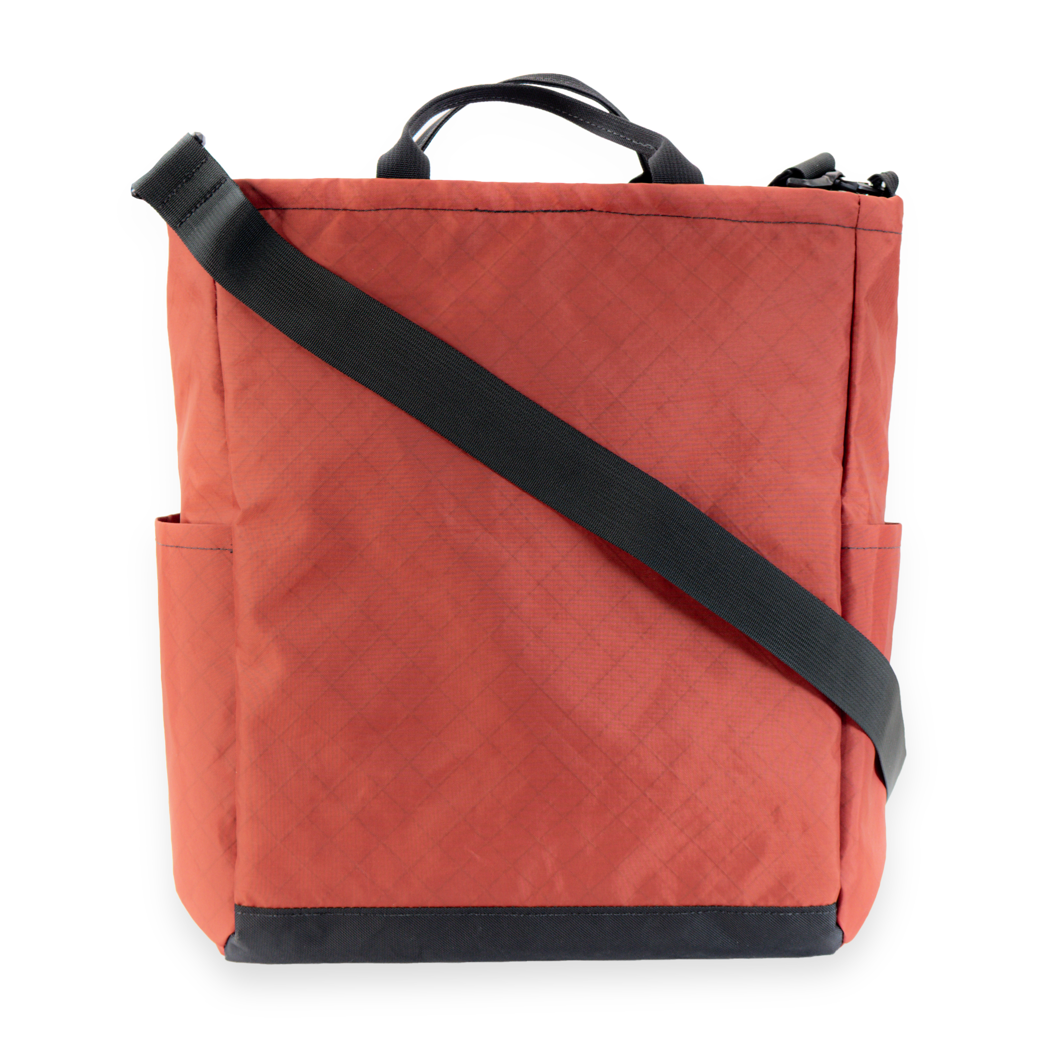 Red crossbody bag with a black strap on a white background