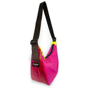 Pink and red crescent shaped crossbody bag