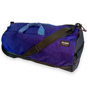 Purple 40L conductor duffle bag with black side panels and multicolor handles