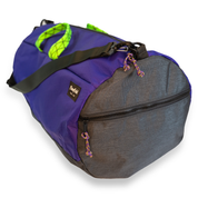 Purple 40L conductor duffle bag with black side panels and green handles