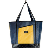 Navy blue and yellow tote bag with a visible Flowfold brand logo on a white background