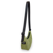 Olive crescent bag with a black strap on a white background at an angle