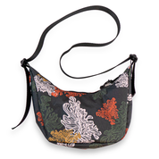 Kelp patterned crescent shaped bag with a black strap on a white background