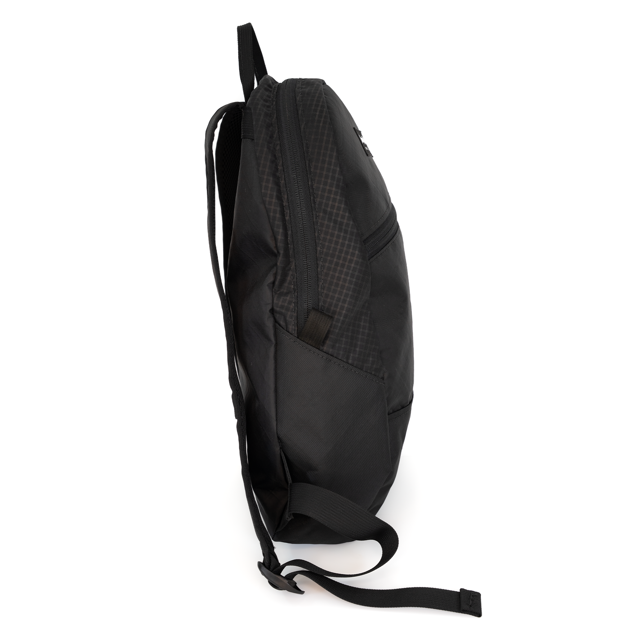A black backpack shown from a side profile view against a plain white background.