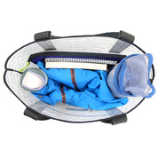 Open bag with a blue jacket, a book, a laptop, a notebook, and a water bottle on a white background