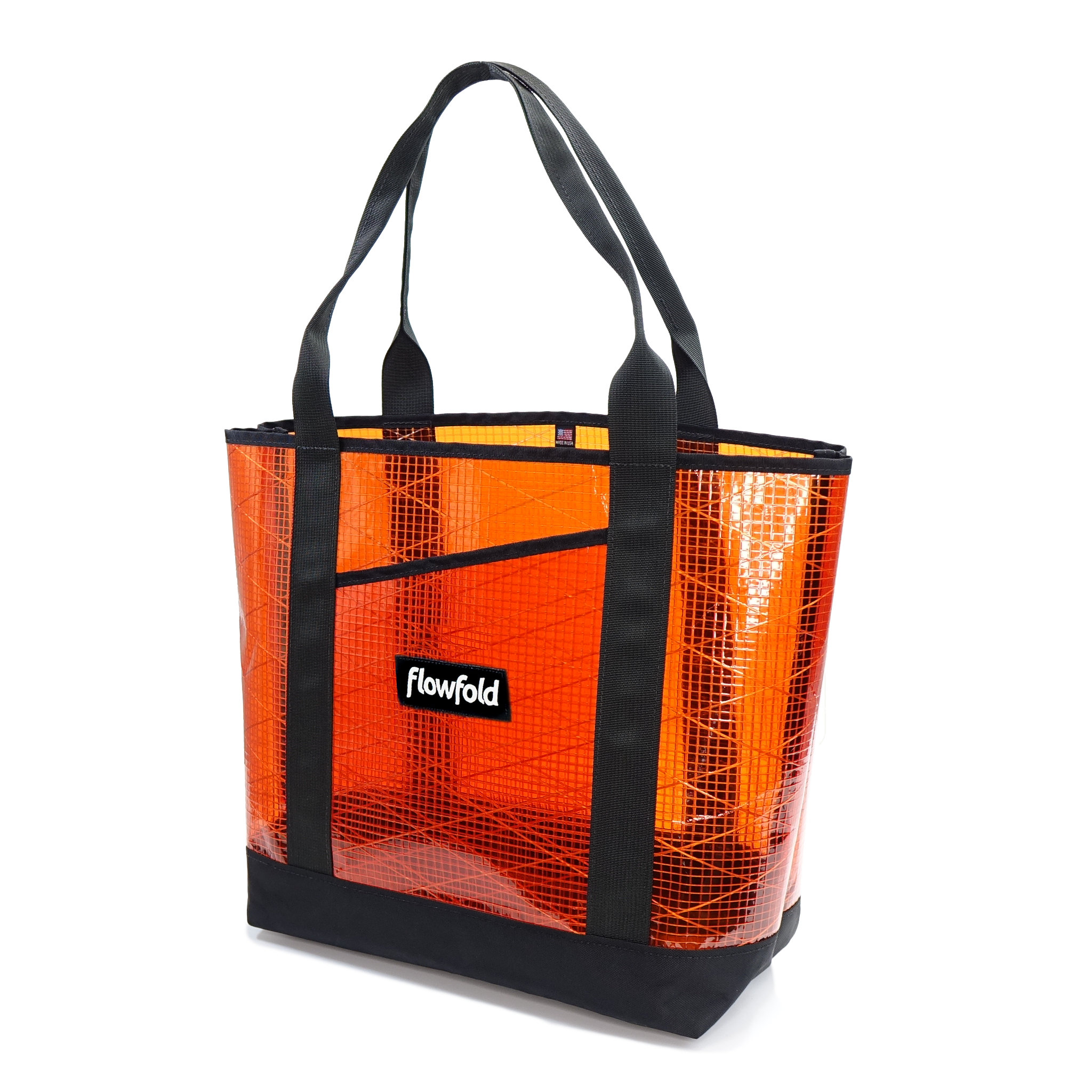 Rust sailcloth tote bag with black handles and a visible brand logo on a white background