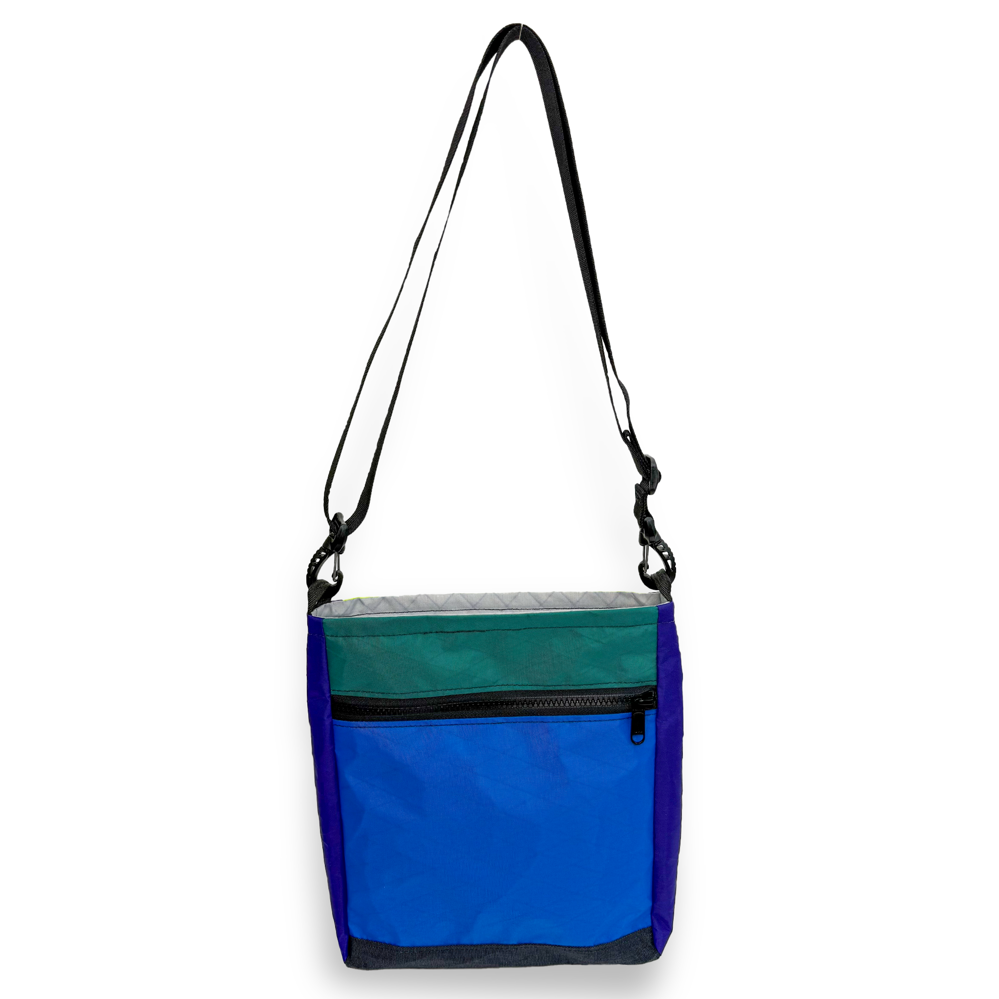 Blue and teal color block crossbody bag with a black strap