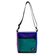 Blue and purple crossbody bag with a strap on a white background