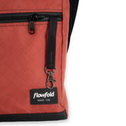 Crossbody bag showing the details, a key leash 