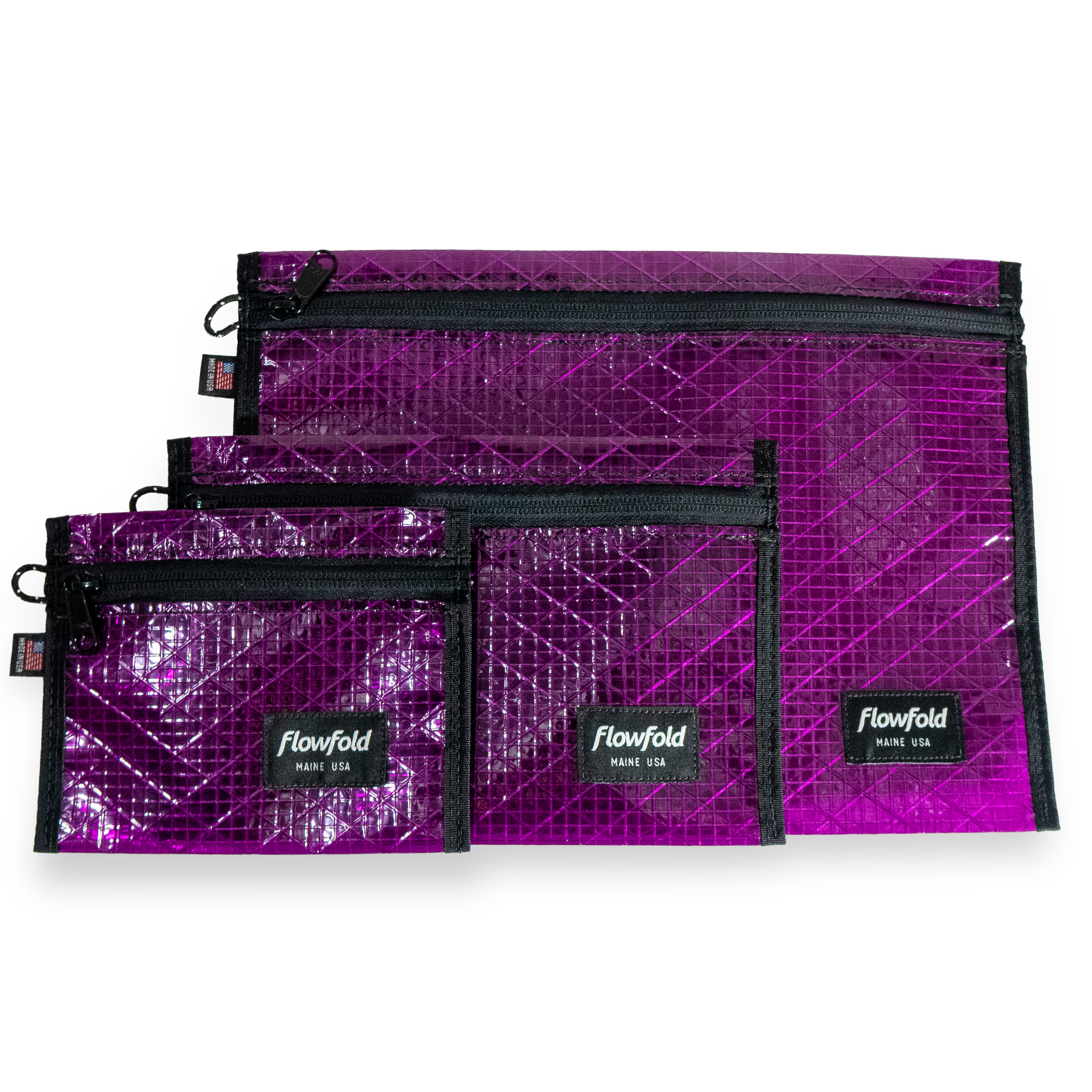 Set of purple recycled sailcloth pouches with black zippers and 'Flowfold' branding on a white background