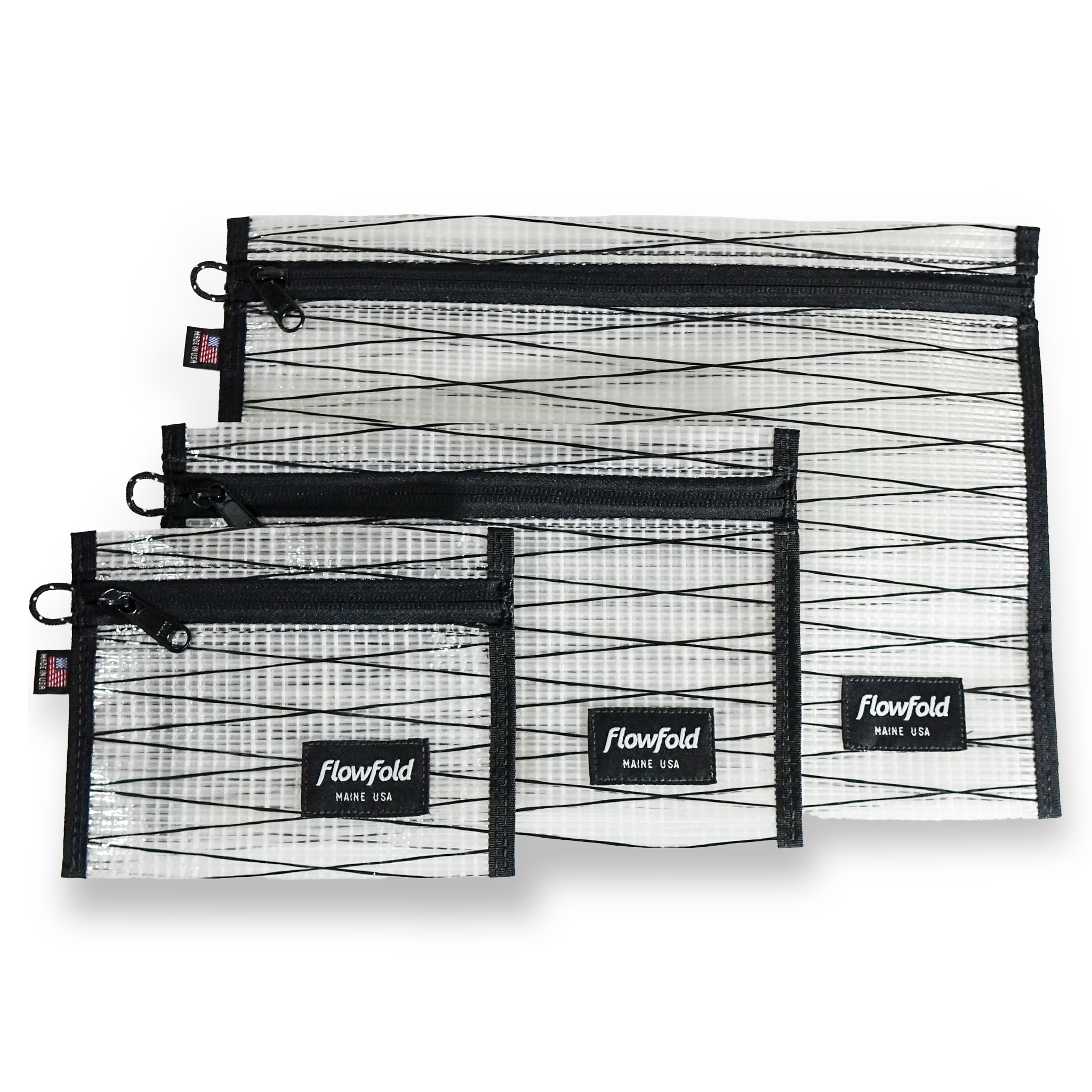 Set of white recycled sailcloth pouches with black zippers and 'Flowfold' branding on a white background