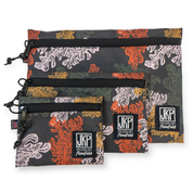 Set of three patterned pouches with 'JKP' branding on a white background