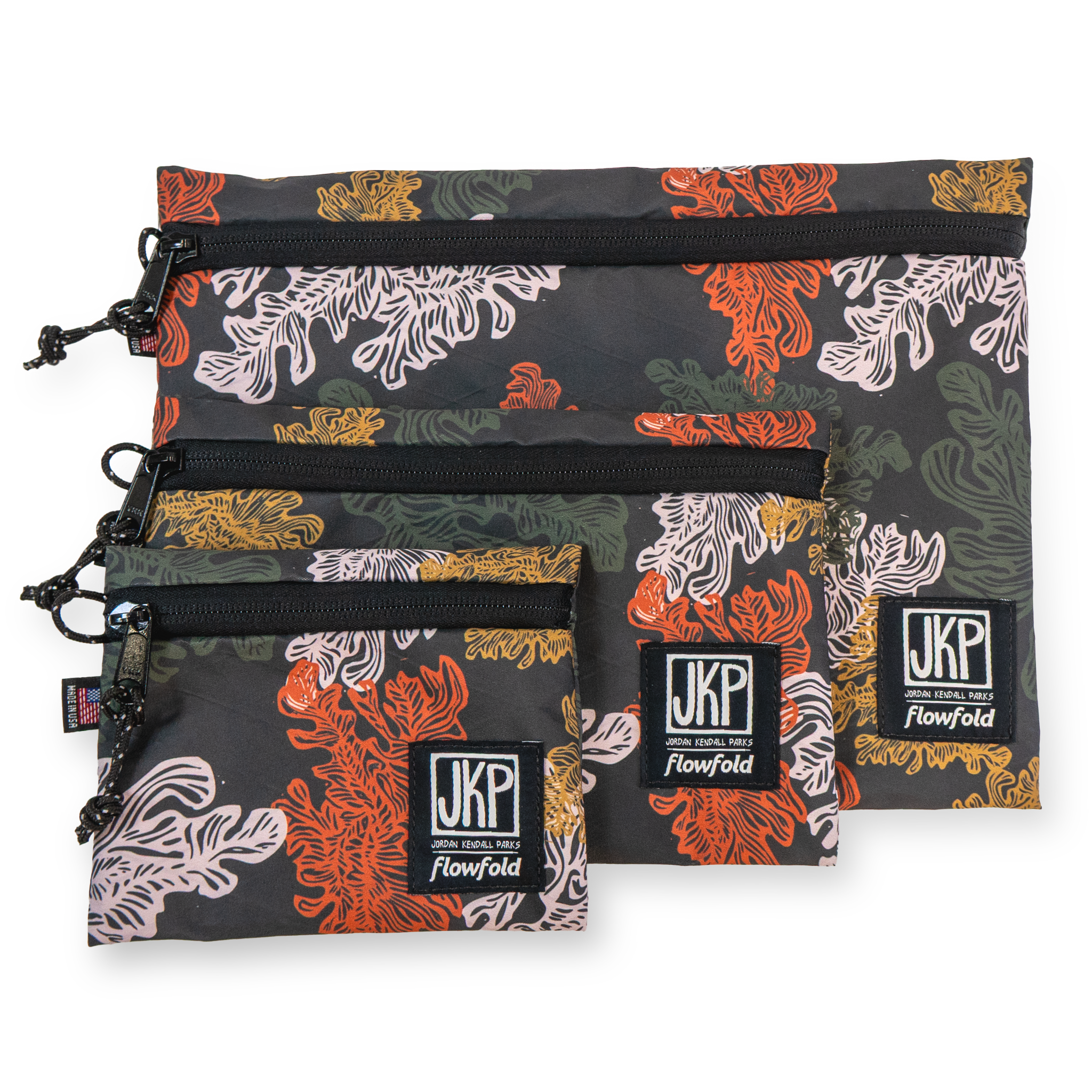 Set of three patterned pouches with 'JKP' branding on a white background