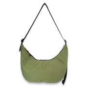 Green crescent bag with a black strap on a white background